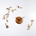 Decorative wall clock with gold bird figurines on a white background available at Spacio retail stores in Mumbaii & Kolkata and online.