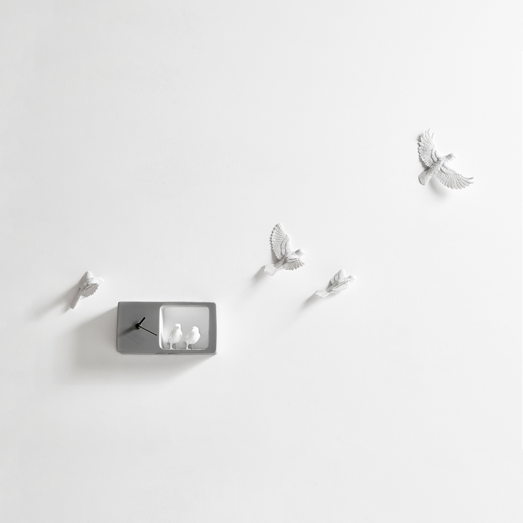 Haoshi Sparrow Clock in Dark Grey color on a white back ground available at Spacio India for modern and luxury interiors from our Timepieces and clocks collection. available at Spacio retail stores in Mumbaii & Kolkata and online.