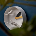 A Clock Haoshi Sparrow Round Yellow Gray with two sparrows on it.