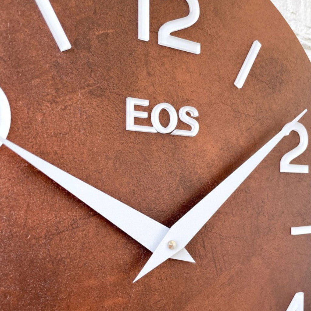 Brown clock with white 'EOS' branding