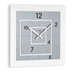 Square wall clock with gray background and white frame on a white background available at Spacio retail stores in Mumbaii & Kolkata and online.