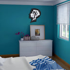 Bedroom with blue walls, white dresser, and decorative items.