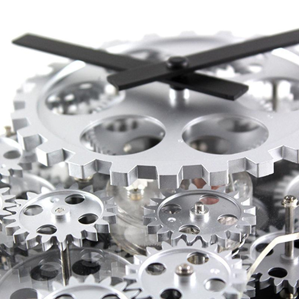 Close-up of a clock with gears and a black hand on a white background