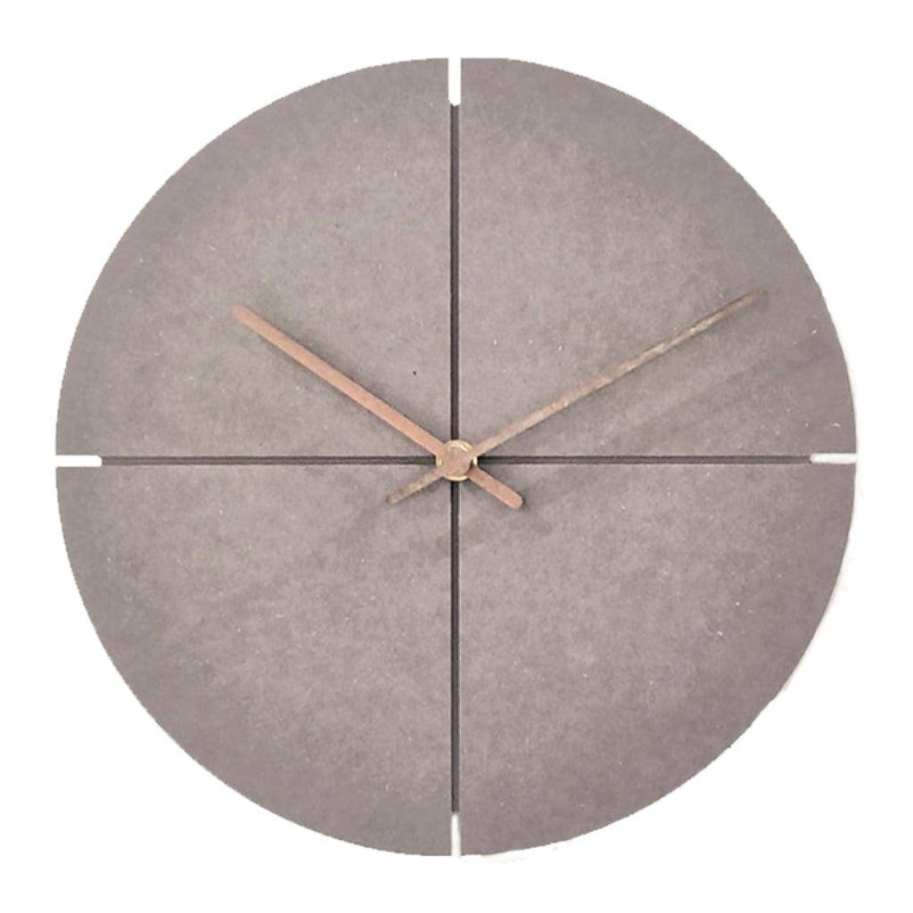 Round concrete wall clock with bronze hour hands on a white background from Kairos available at Spacio retail stores in Mumbaii & Kolkata and online.