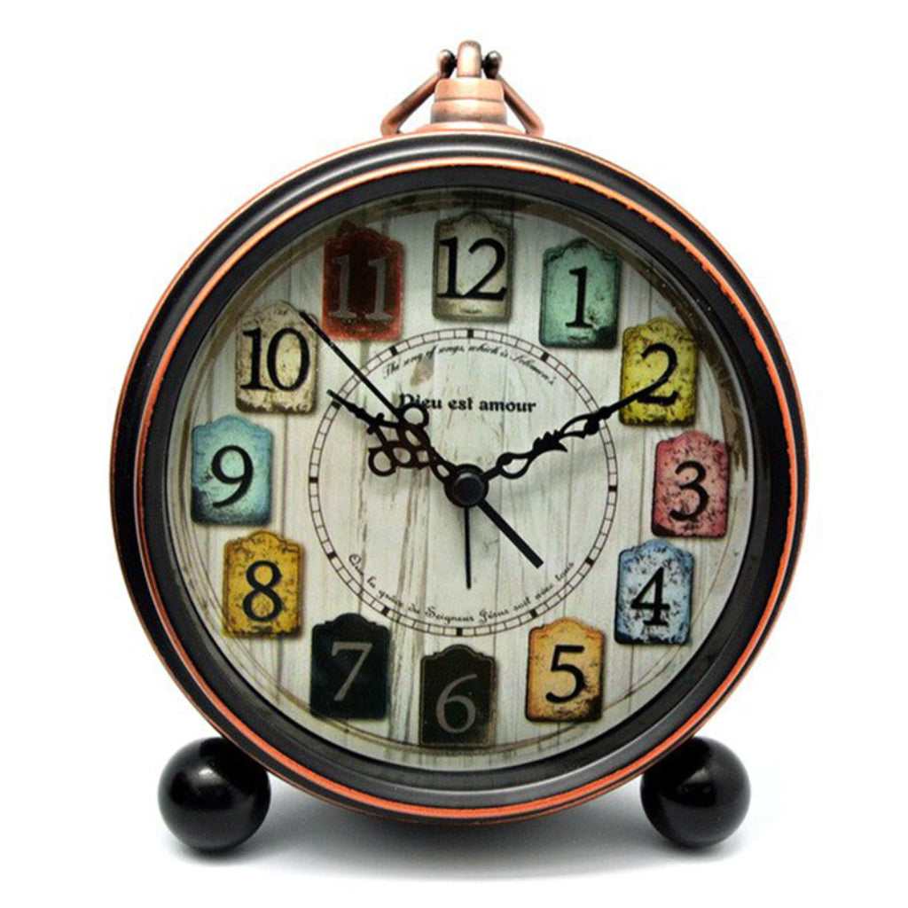 Vintage-style alarm clock with colorful number blocks on a white background from Kairos available at Spacio retail stores in Mumbaii & Kolkata and online.