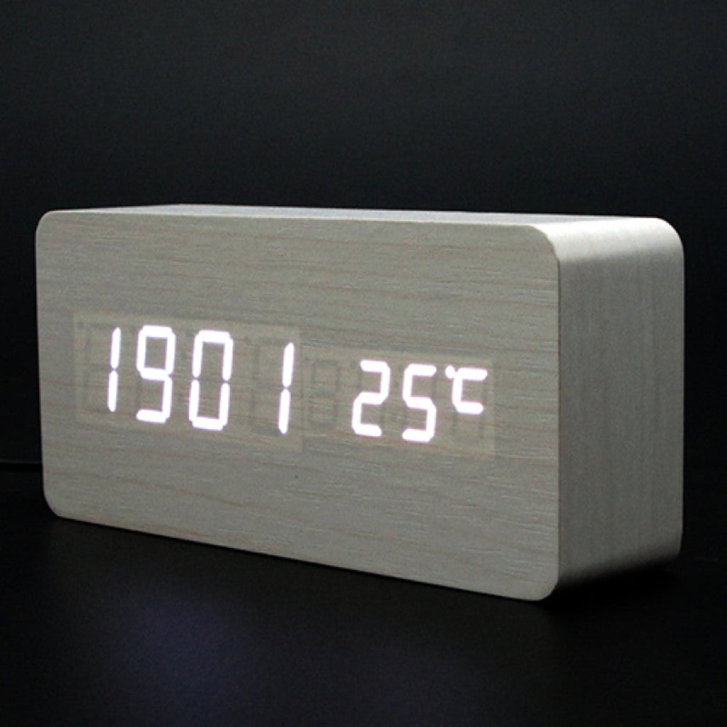 Digital clock with LED display on a dark background