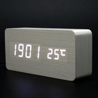 Digital clock with LED display on a dark background