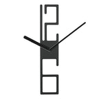 Modern black wall clock with abstract design on a white  background from Karlsson available at Spacio retail stores in Mumbaii & Kolkata and online.