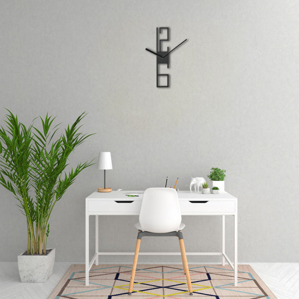 Modern office setup with a white desk, chair, and decorative wall clock.