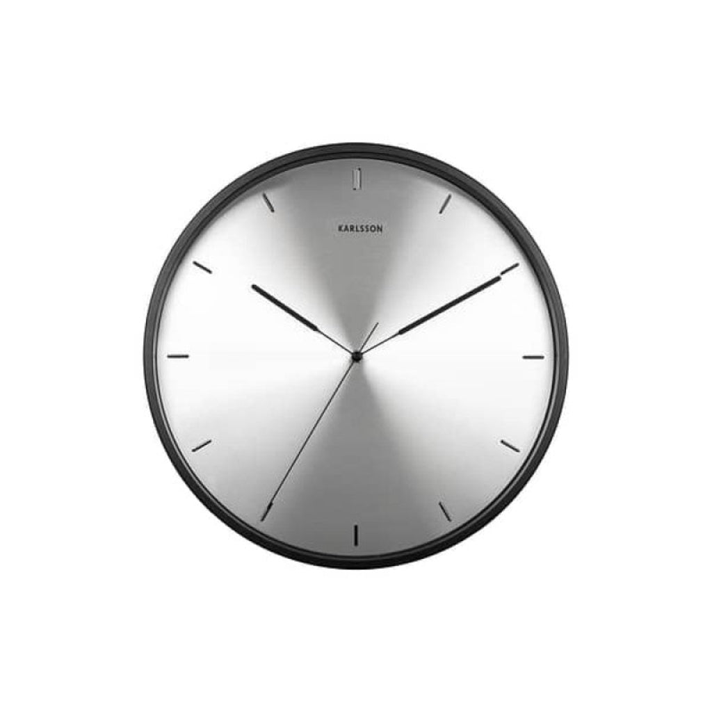 Round wall clock with black frame and silver face on a white background from Karlsson available at Spacio retail stores in Mumbaii & Kolkata and online.