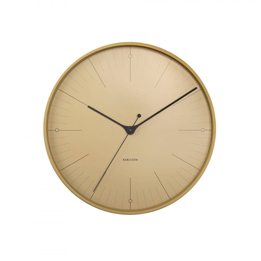 Gold wall clock with black hands on a white background from Karlsson available at Spacio retail stores in Mumbaii & Kolkata and online.