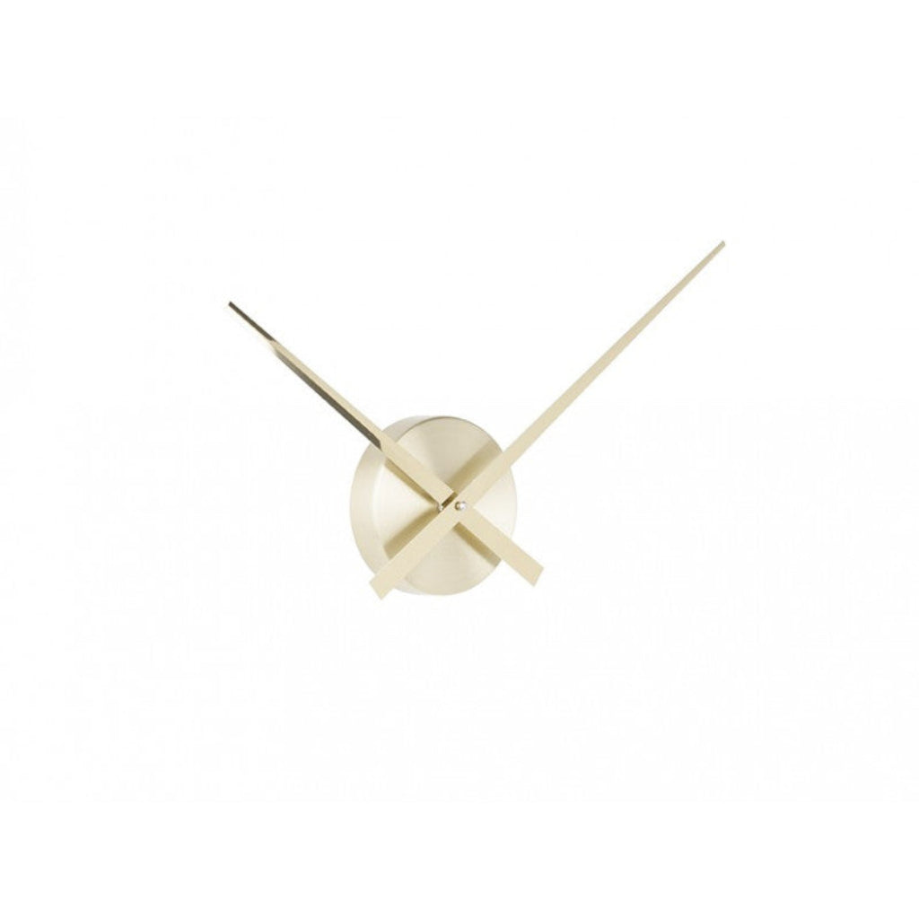 Gold wall clock with minimalist design on a white background