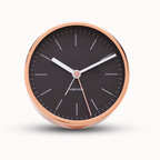 Round clock with black face and rose gold frame on a white background from Karlsson available at Spacio retail stores in Mumbaii & Kolkata and online.