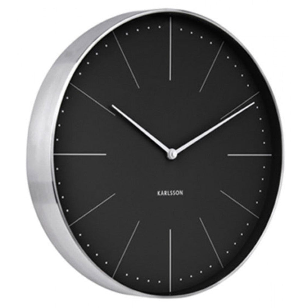 Black wall clock with silver frame on a white background
