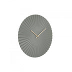 Gray wall clock with sunburst design on a white background