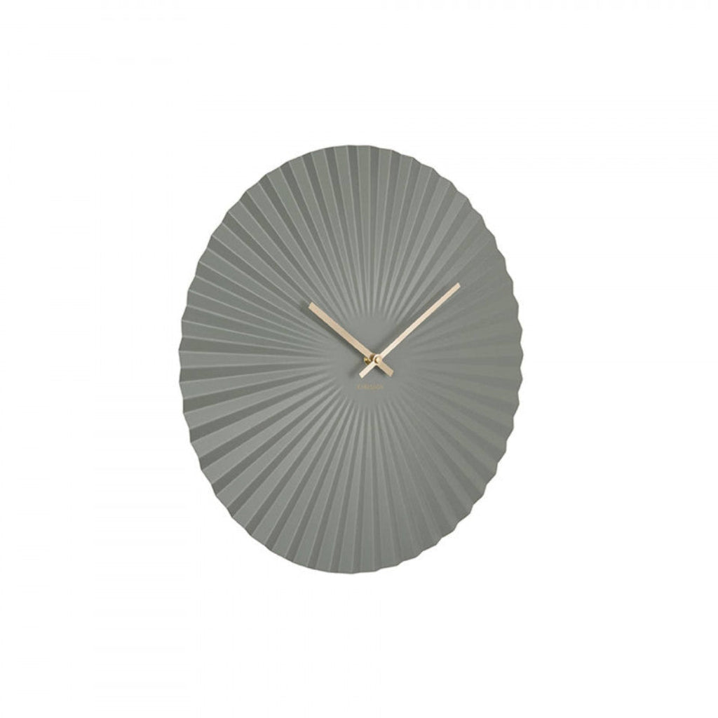 Gray wall clock with sunburst design on a white background