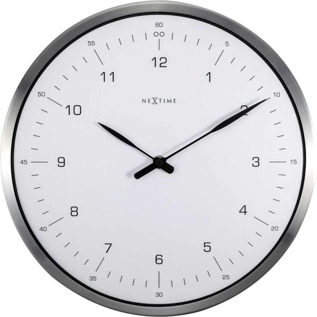 Round wall clock with white face and black hands, branded 'NeXtime', on a white background. from Nextime available at Spacio retail stores in Mumbaii & Kolkata and online.