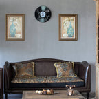 Living room with a brown sofa, decorative pillows, and wall art.