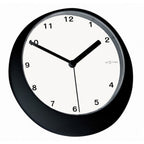 Black wall clock with white face on a white background from Nextime available at Spacio retail stores in Mumbaii & Kolkata and online.