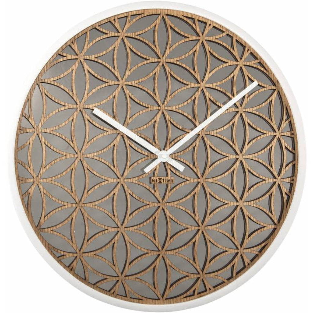 Decorative wall clock with geometric pattern on a white background from Nextime available at Spacio retail stores in Mumbaii & Kolkata and online.