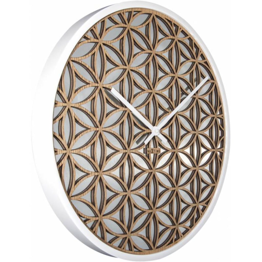 Decorative wall clock with geometric pattern on a white background