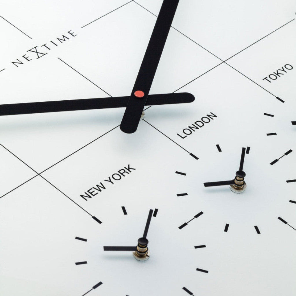 Clock with world time zones labeled on a white background
