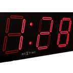 Digital clock with red LED digits displaying '9:00' on a black background, featuring the brand 'Nextime'.