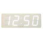 Digital clock with white display on a beige background from Nextime available at Spacio retail stores in Mumbaii & Kolkata and online.