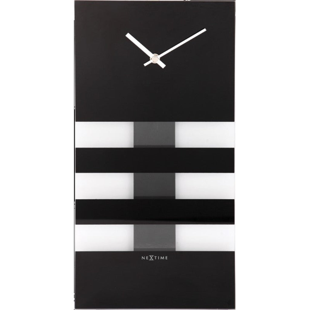 Black and white striped wall clock with 'NeXtime' branding on a white background available at Spacio retail stores in Mumbaii & Kolkata and online.