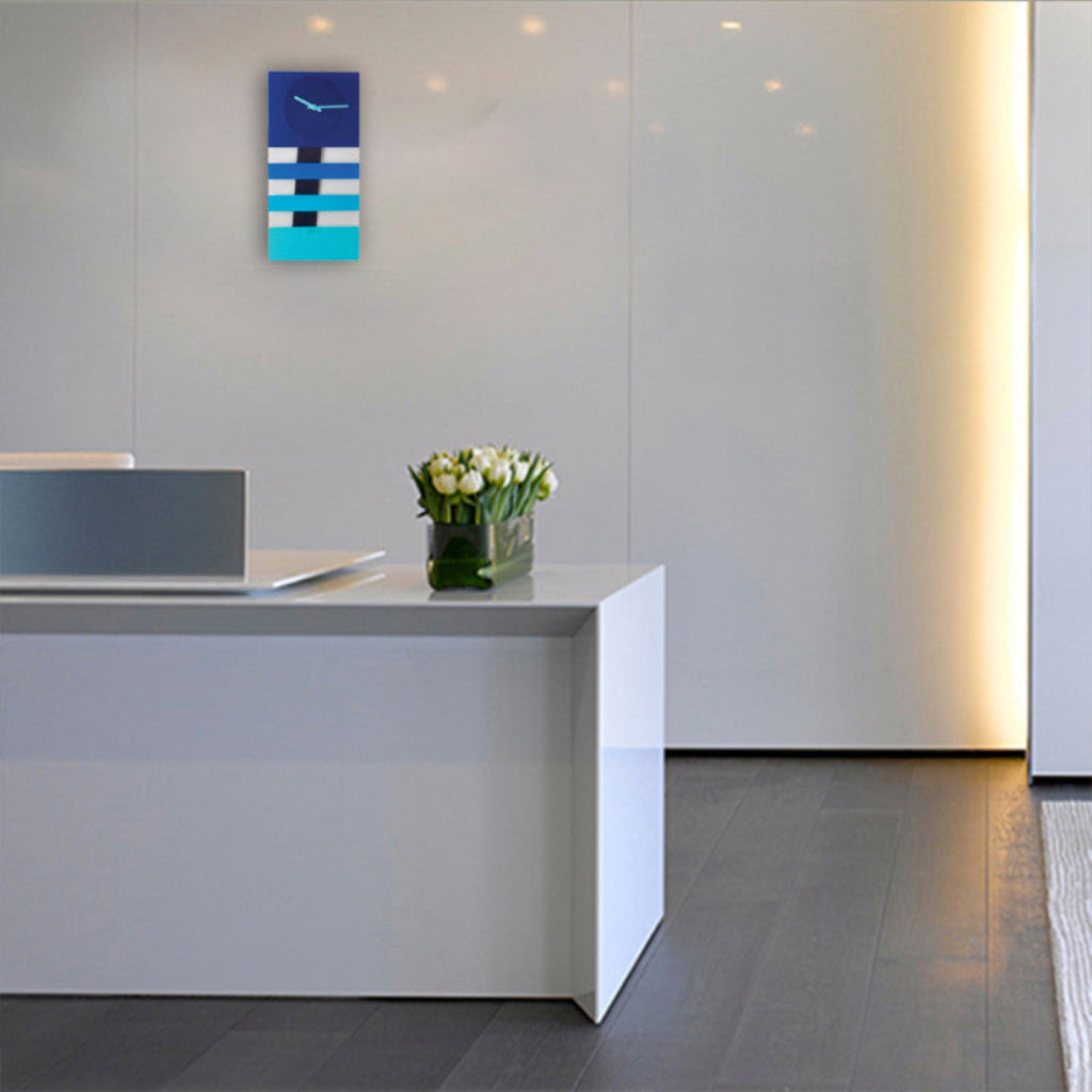 Modern office reception area with a white desk and decorative elements.