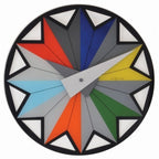 Colorful geometric clock with red, blue, yellow, green, orange, and gray colors on a white background. from Nextime available at Spacio retail stores in Mumbaii & Kolkata and online.