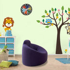 Children's room with purple bean bag chair, tree wall decal, and animal stickers.