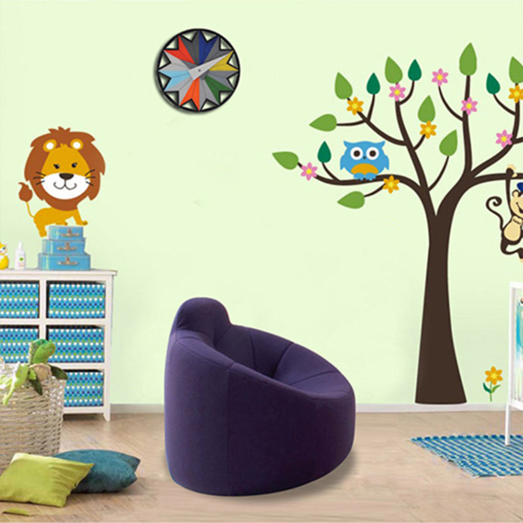 Children's room with purple bean bag chair, tree wall decal, and animal stickers.