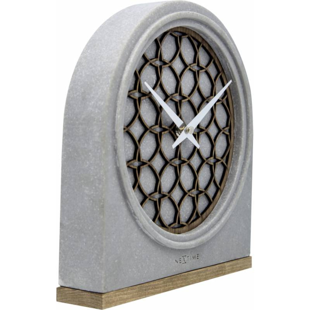 Decorative clock with lattice design on a white background