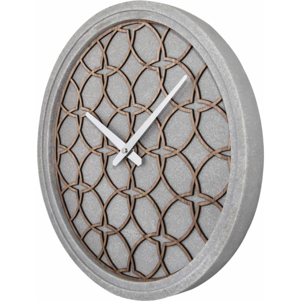 Decorative wall clock with geometric pattern on a white background