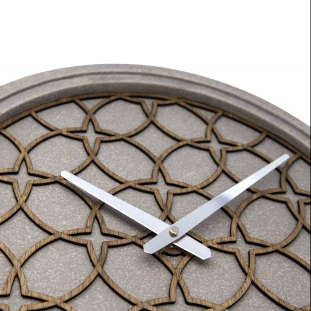 Decorative wall clock with geometric pattern on a white background