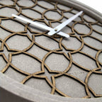 Wall clock with geometric pattern on a neutral background