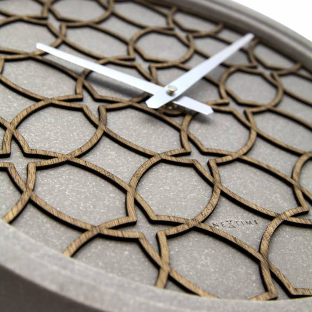 Wall clock with geometric pattern on a neutral background