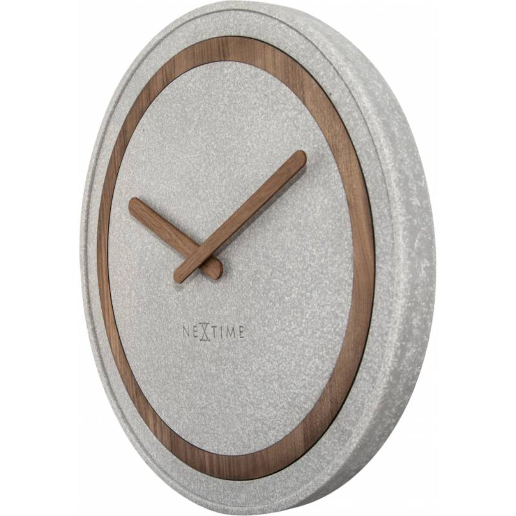 Wall clock with wooden hands and gray concrete-like casing on a white background