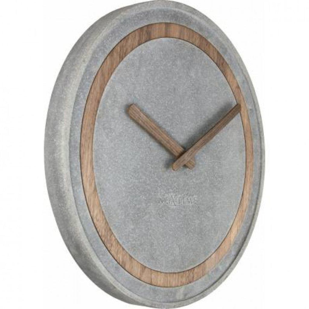 Wall clock with concrete-like finish and wooden accents on a white background