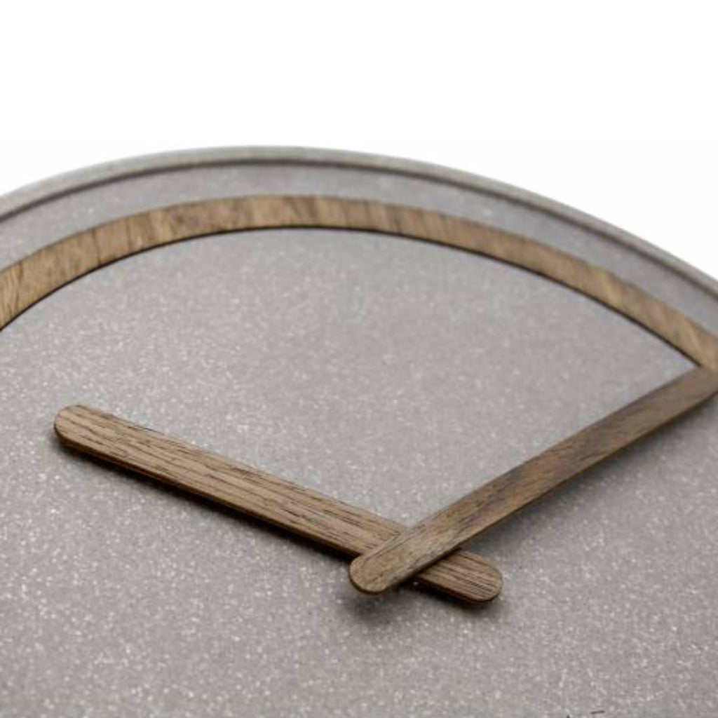 Wooden frame with two sticks on a textured gray surface