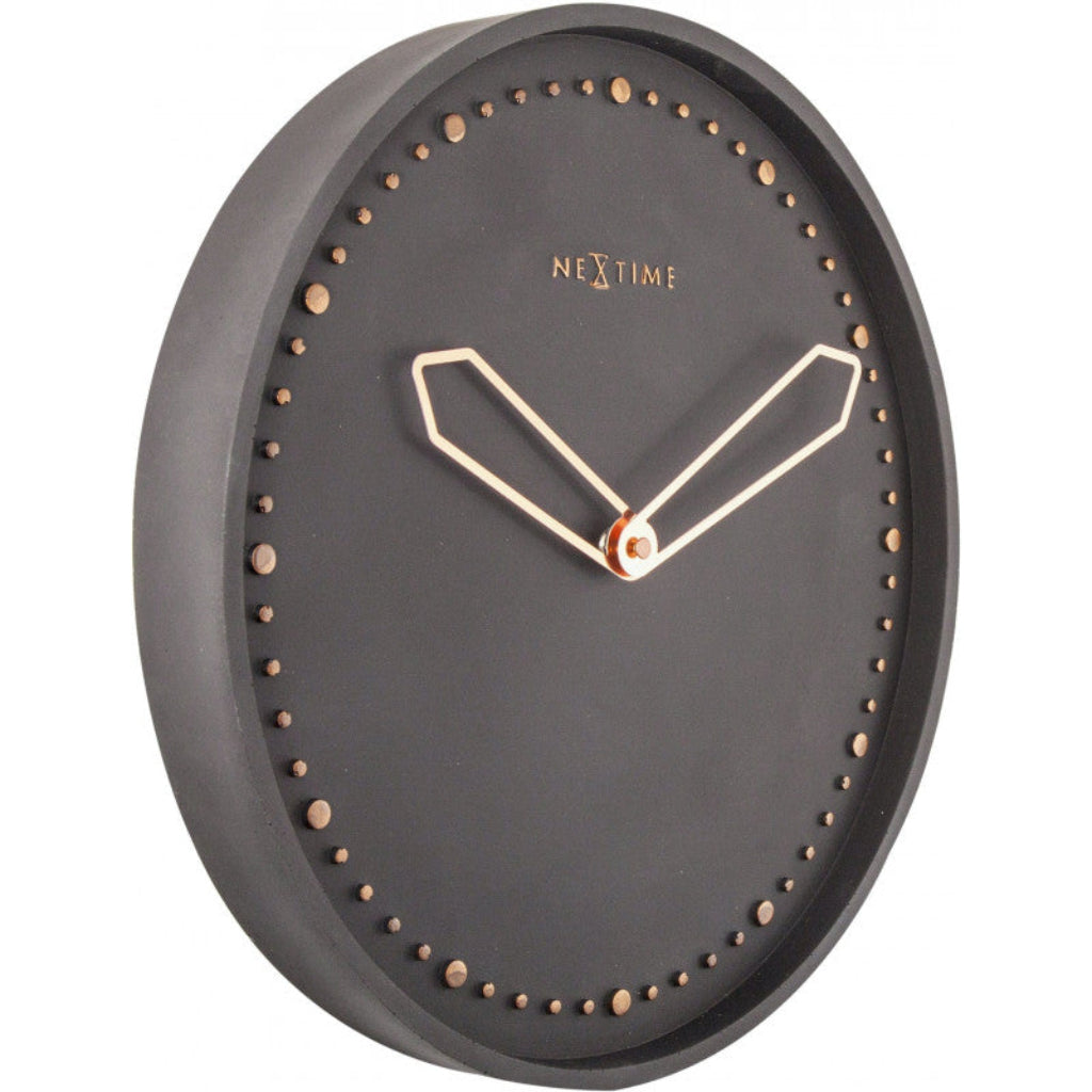 Black wall clock with gold accents on a white background