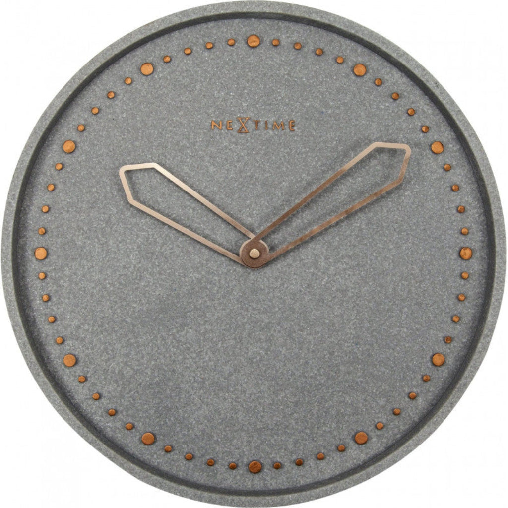 Gray wall clock with bronze accents on a white background from Nextime available at Spacio retail stores in Mumbaii & Kolkata and online.