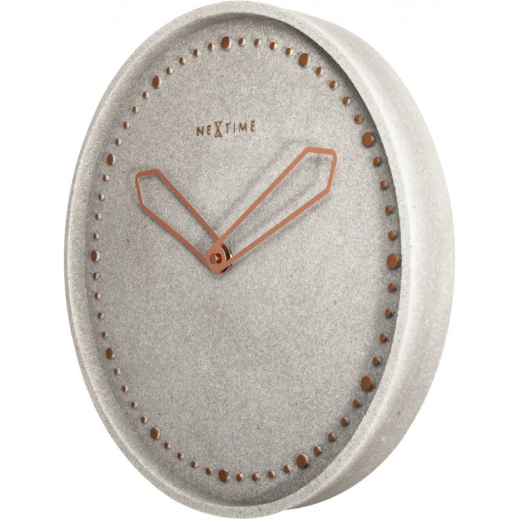 Gray wall clock with copper hands on a white background