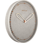 Gray wall clock with gold accents on a white background