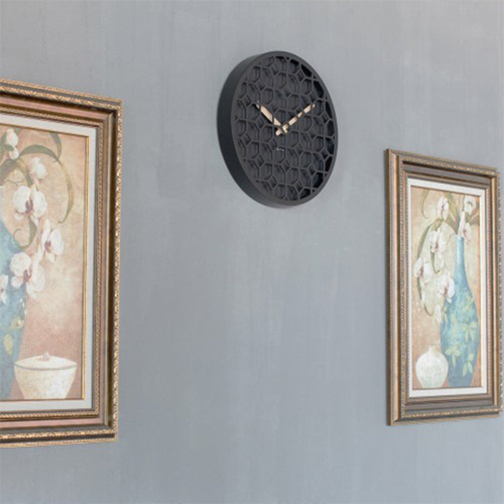 Decorative wall clock with floral paintings on a gray wall