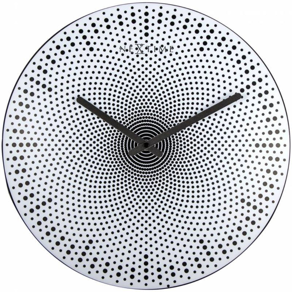 Wall clock with black dot pattern on a white background from Nextime available at Spacio retail stores in Mumbaii & Kolkata and online.