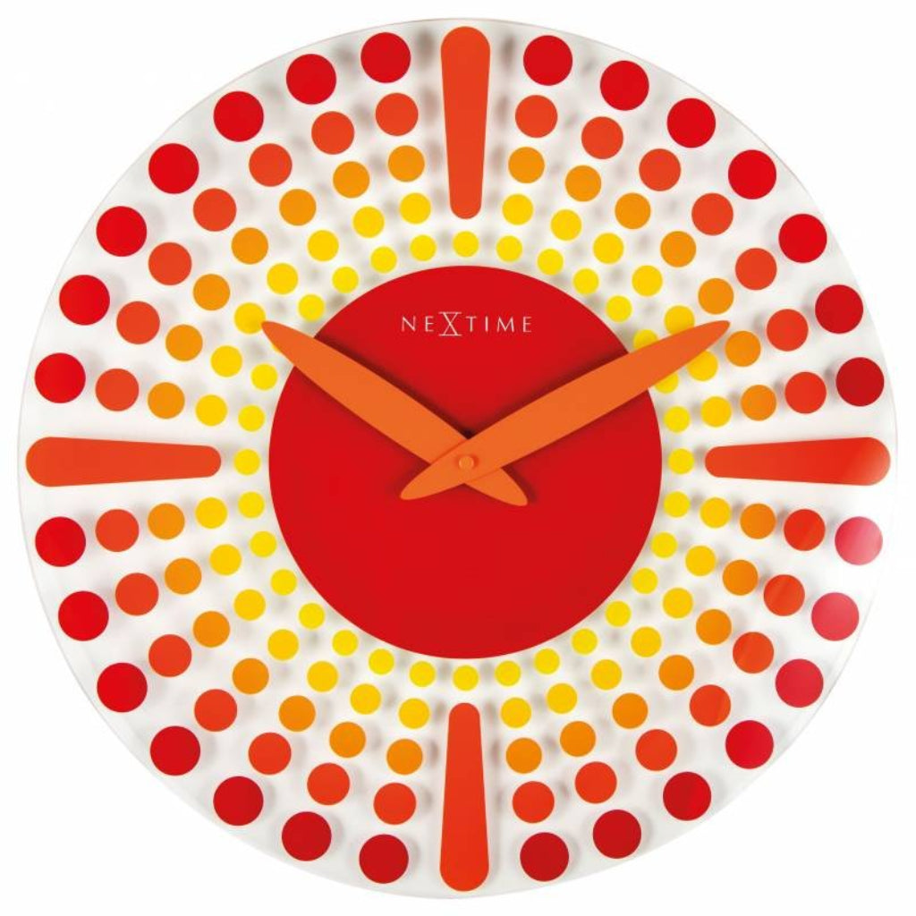 Decorative wall clock with red, orange, and yellow polka dot design on a white background from Nextime available at Spacio retail stores in Mumbaii & Kolkata and online.