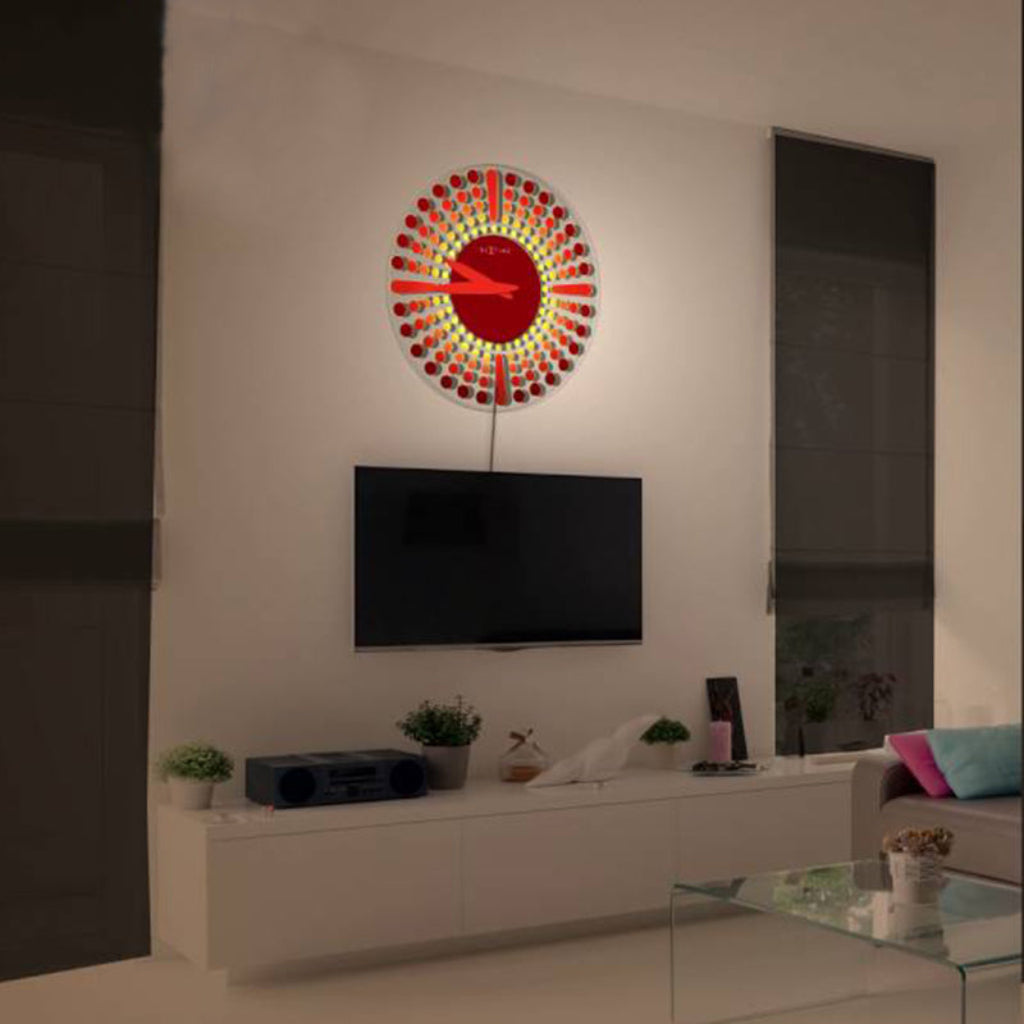 Colorful wall clock in a modern living room with a TV and decor items.