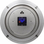 Round metallic object with a central blue and red component on a white background